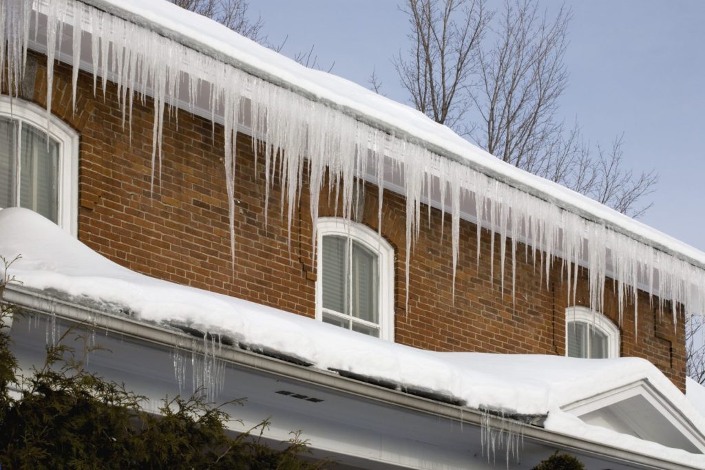 Frozen gutters causing roof damage
